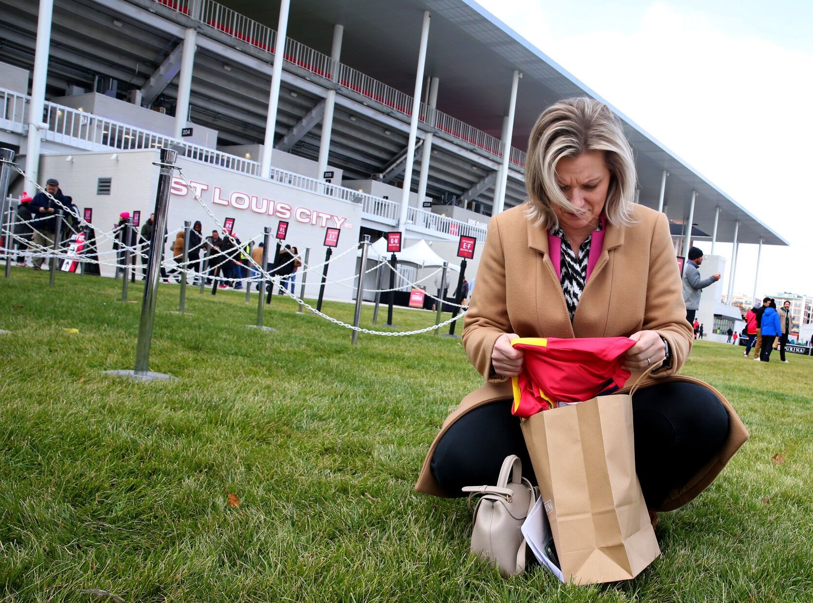 Fans pickup jerseys before warmup game at CityPark stadium